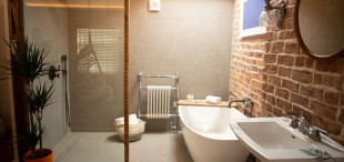 Reclaimed brick and stone in one of the B & B bathrooms in the Cartford Inn