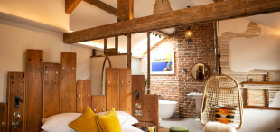 Reclaimed timbers used in a B & B bedroom at the Cartford Inn